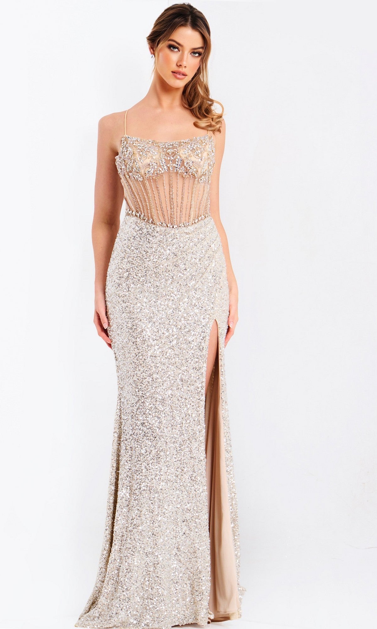 A woman models the Jovani 49611 Long Prom Dress, a sleeveless, floor-length sequin corset gown with a high slit, adjustable lace-up back, and sheer crystal-beaded bodice, standing against a plain white background.
